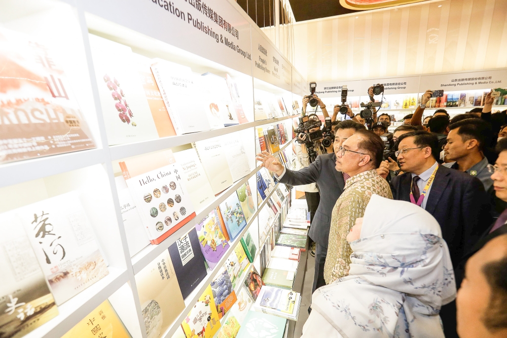 Prime Minister Datuk Seri Anwar Ibrahim (centre) visits the China book exhibition during the launch of the Kuala Lumpur International Book Festival at Putra World Trade Centre, Kuala Lumpur May 27, 2023. — Picture by Sayuti Zainudin