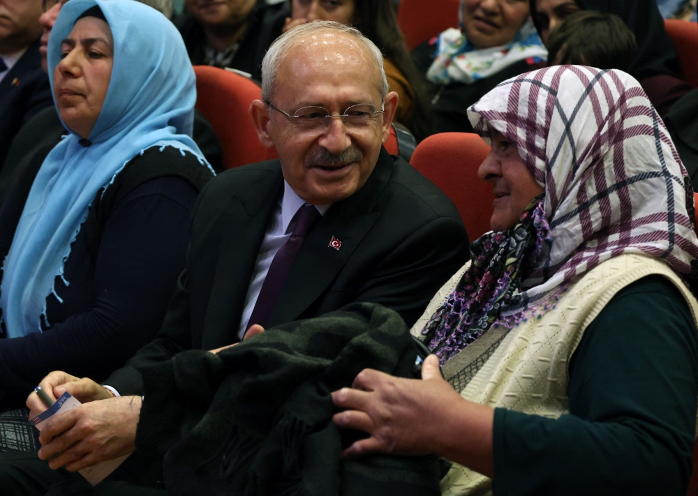 Kemal Kilicdaroglu (centre), presidential candidate of Turkey’s main opposition alliance, attends an indoor campaign event ‘Family Support Insurance Meeting’, ahead of the May 28 presidential runoff vote, in Ankara on May 27, 2023. — AFP pic