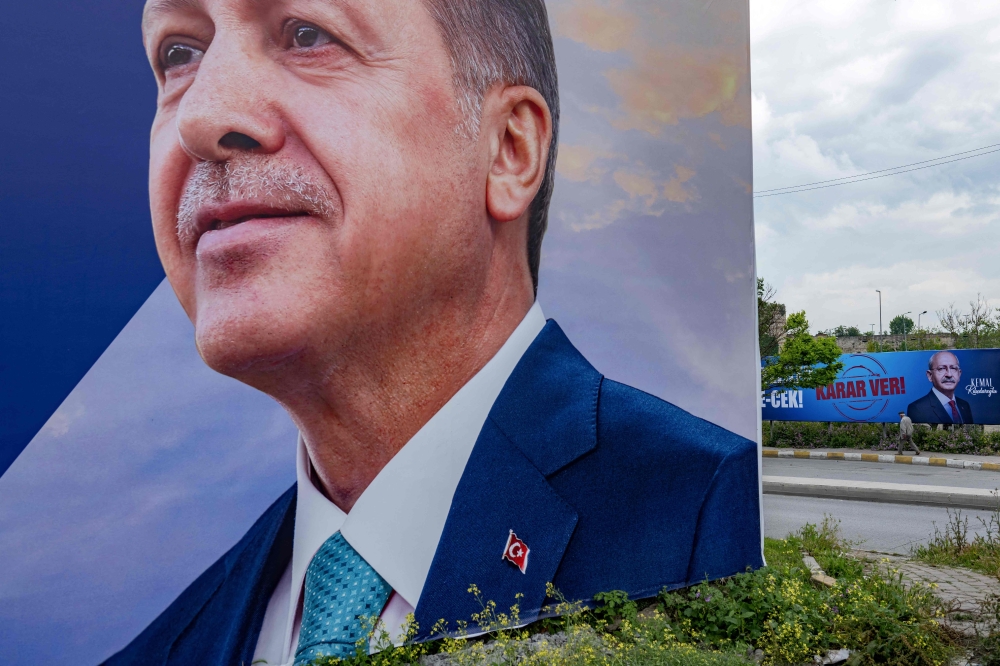 Campaign posters bearing photos of Turkey’s presidential candidates, Turkish President Recep Tayyip Erdogan (left) and leader of the opposition Republican People’s Party (CHP) Kemal Kilicdaroglu (right) are seen in Istanbul, on May 23, 2023. — AFP pic