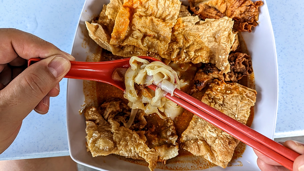 Some digging is required, but there are some silky smooth noodles underneath all the fried stuff.