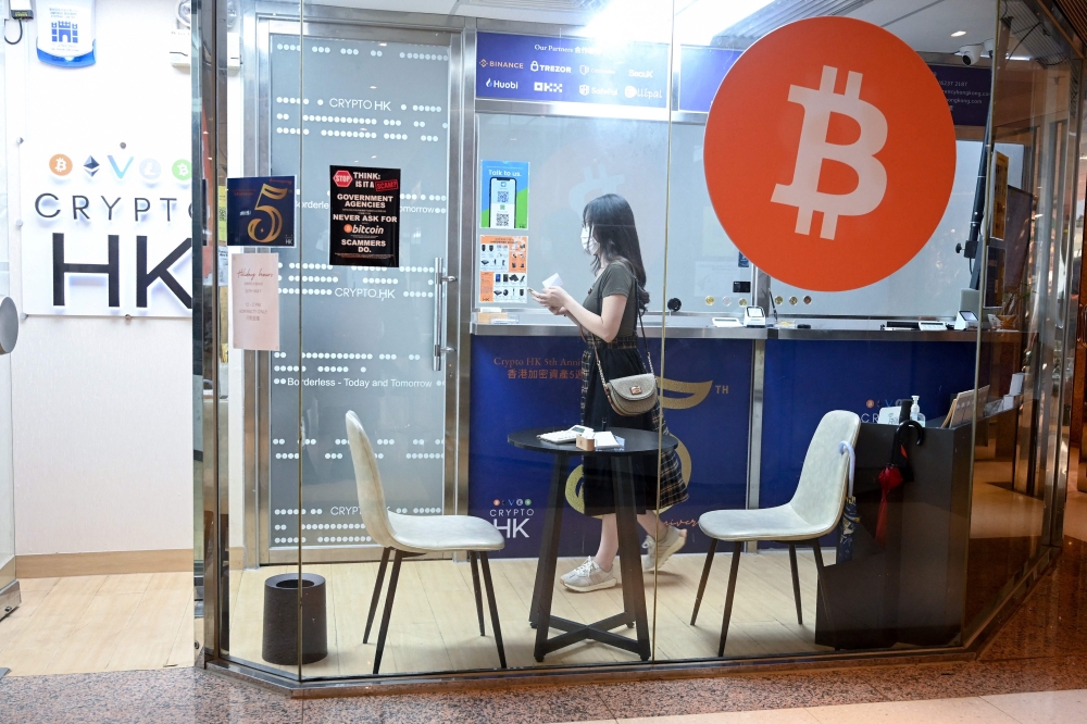 Retail investors in Hong Kong may soon be able to buy popular cryptocurrencies like bitcoin at government-licensed exchanges, thanks to new rules meant to bolster the city’s standing as a digital asset hub. — AFP pic