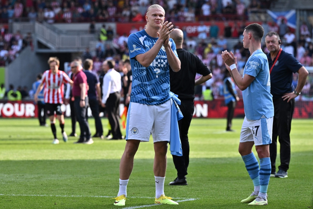 Manchester City's Norwegian striker Erling Haaland acknowledges fans at the end of the English Premier League football match between Brentford and Manchester City at Gtech Community Stadium in London on May 28, 2023. — AFP pic