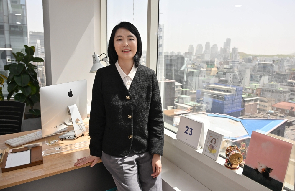 This picture taken on April 12, 2023 shows Noh Yoon-ho, a Seoul-based attorney who specialises in bullying cases, posing for a photo during an interview with AFP at her office in Seoul. — AFP pic