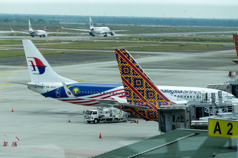 A Malaysia Airlines planes are seen on the tarmac at KLIA in Sepang March 21, 2023. — Picture by Raymond Manuel