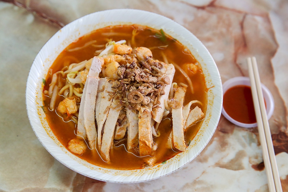 Butterworth native Goh makes a simple, tasty prawn mee topped with blanched pork slices and small shelled prawns.