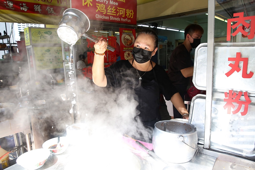 Sam Kan Cheong stall owner Madam Tan operates her business with the help of her son, Chang Kar Lok (back).