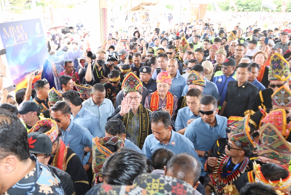 Prime Minister Datuk Seri Anwar Ibrahim waves as he arrives at the Kadazandusun Cultural Association in Kota Kinabalu for the state-level Kaamatan festival, May 31, 2023. — Picture courtesy of Sabah Chief Minister's Department