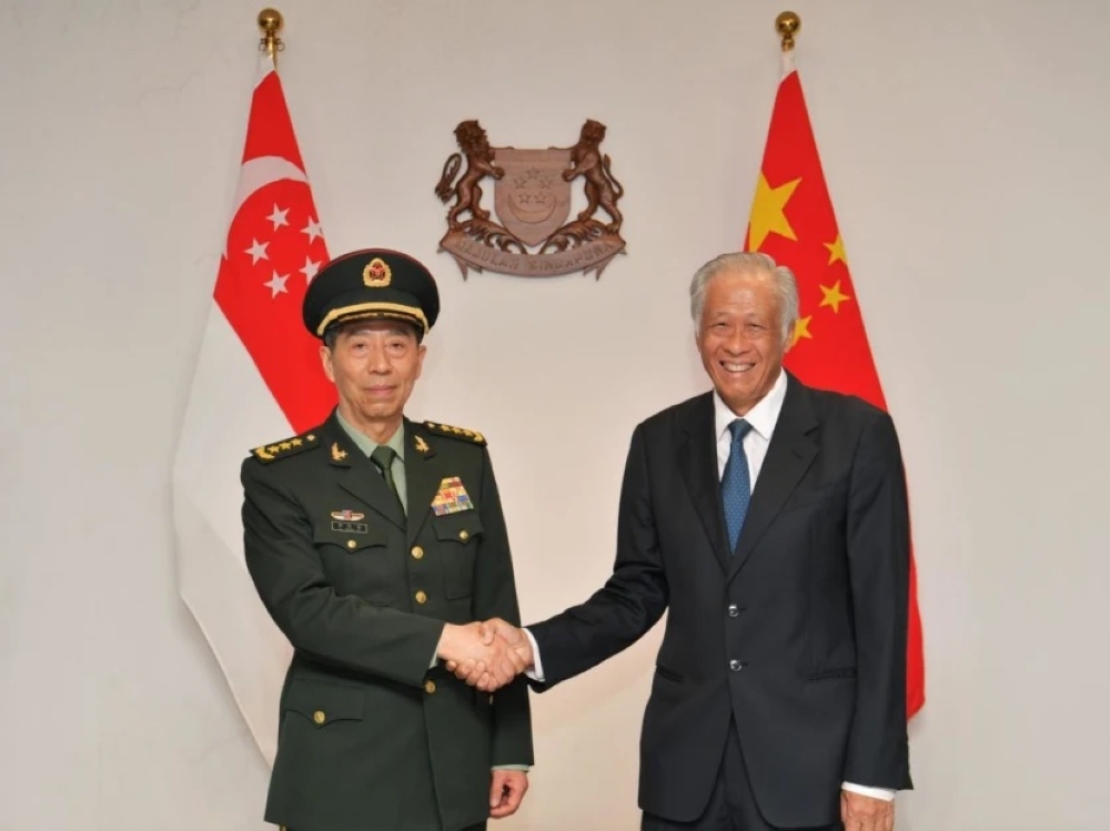 China's Defence Minister Li Shangfu (left) meeting Singapore's Defence Minister Ng Eng Hen on June 1, 2023. — TODAY pic