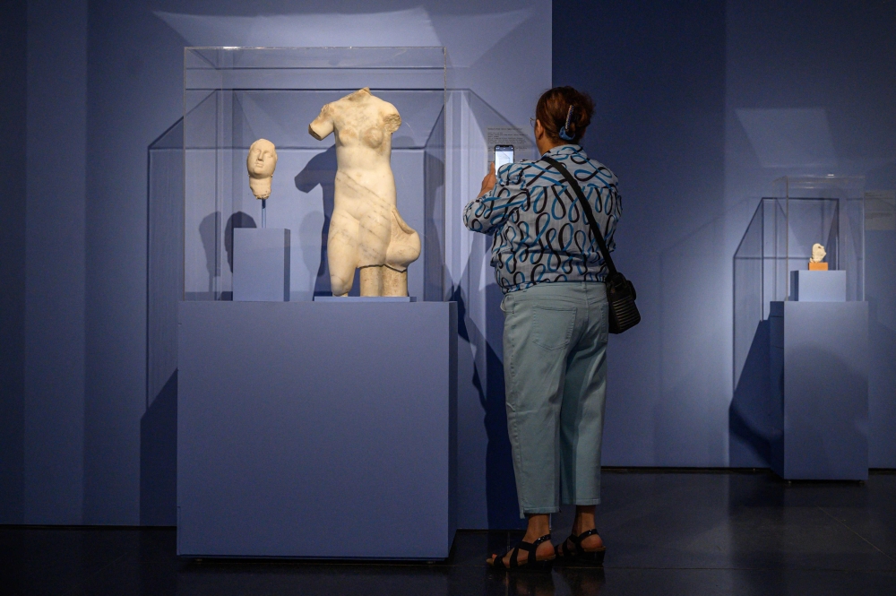 A visitor looks at a work by an ‘unidentified Greco-Egyptian artist’ on display at an exhibition titled ‘It’s Pablo-matic: Picasso According to Hannah Gadsby’ at the Brooklyn Museum in New York. — AFP pic