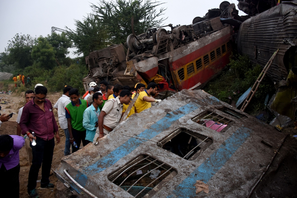 Rescue workers search for survivors after two passenger trains collided in Balasore district in the eastern state of Odisha, India, June 3, 2023. — Reuters pic