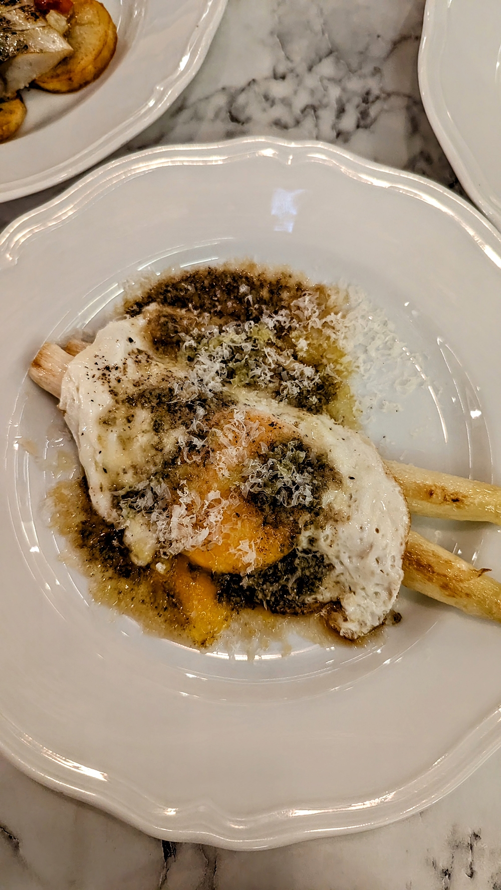 One of the simplest, most surprising standouts of the night: White Asparagus Milanese.