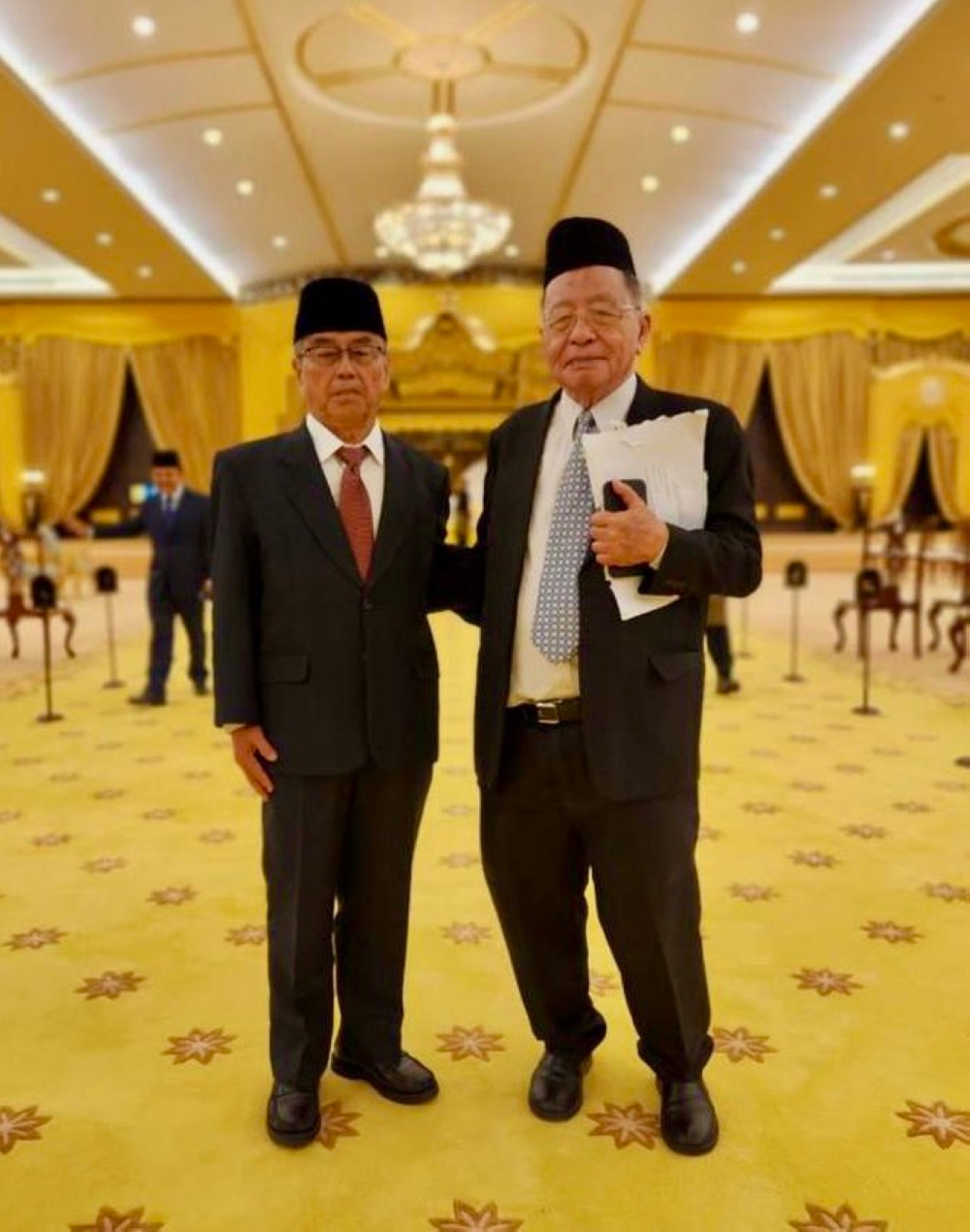 The photo of Lim Kit Siang (right) with a palace official that went viral online on Saturday night, June 3, 2023. — Picture via Facebook
