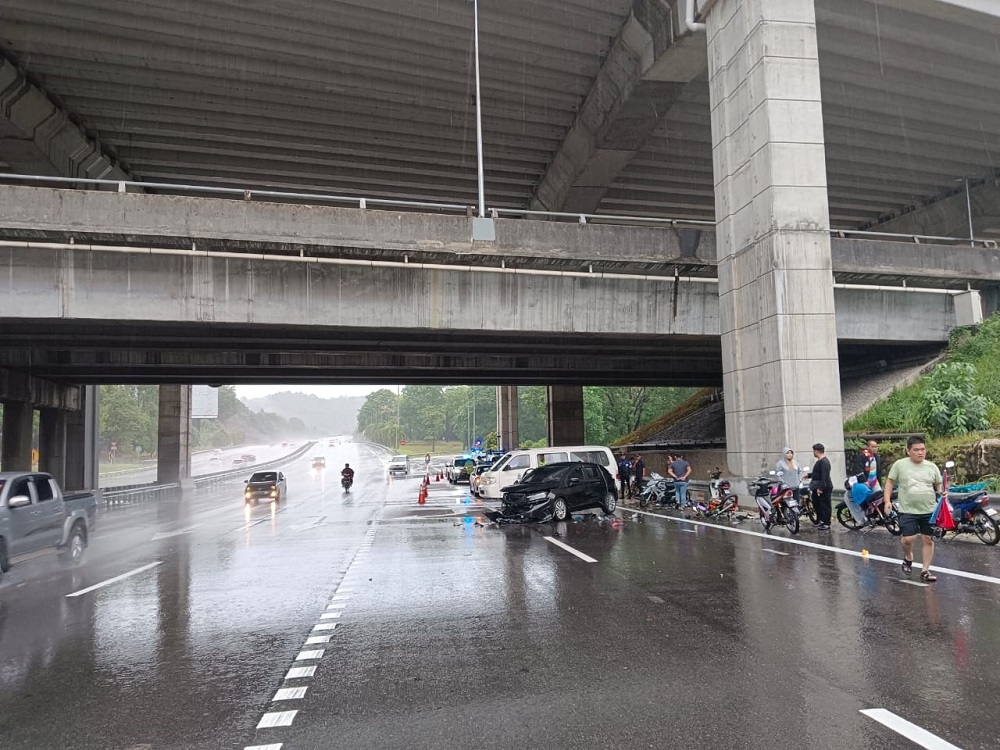 Three motorcyclists were killed while three others were injured after being mowed down by a car while taking shelter under an overhead bridge at KM19.6 of the New Klang Valley Expressway (NKVE) southbound near Petaling Jaya this morning. — Picture courtesy of IPD Petaling Jaya