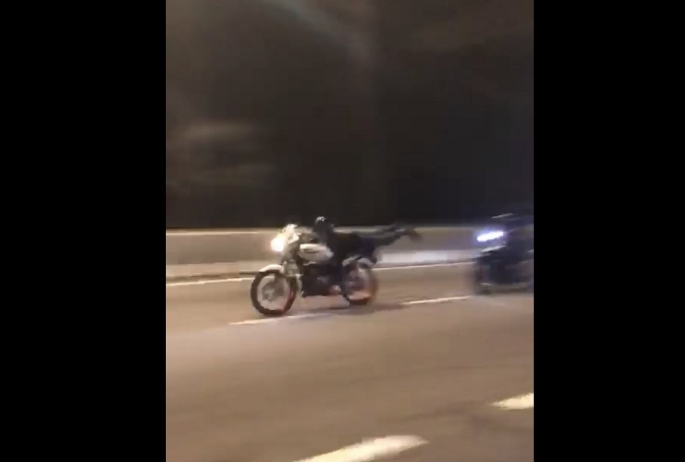 A screengrab from the 16-second video footage shows the victim doing ‘Superman’ stunts and competing with a friend while riding a motorcycle. — Picture from social media