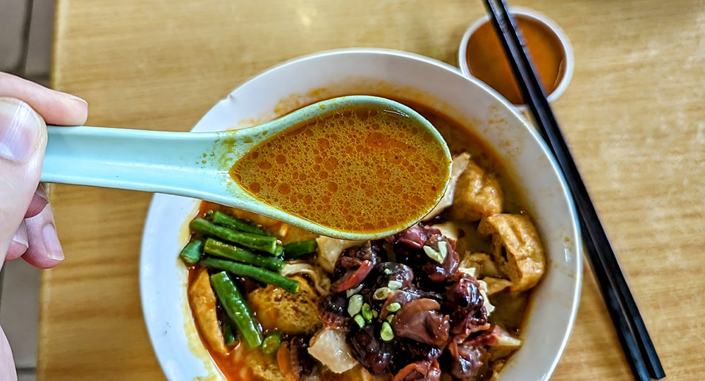 A spoonful of the glorious curry here.