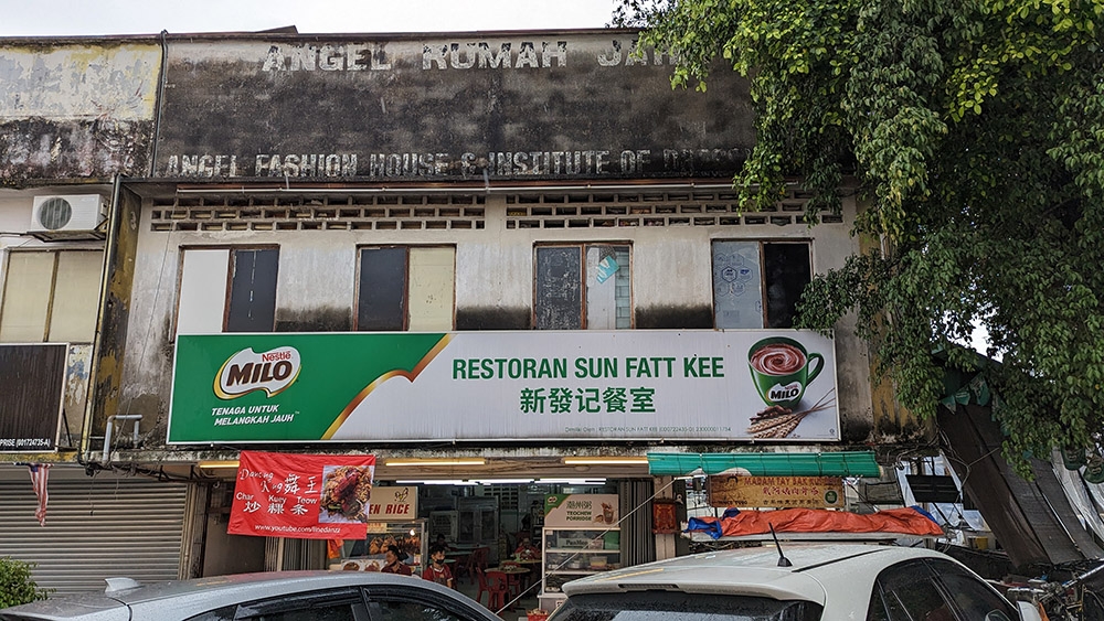 Look for the corner coffee shop at the top of the road, behind Maybank.