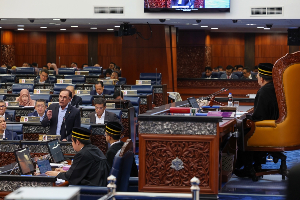 Prime Minister Datuk Seri Anwar Ibrahim speaks at the Parliament in Kuala Lumpur June 6, 2023. — Bernama pic