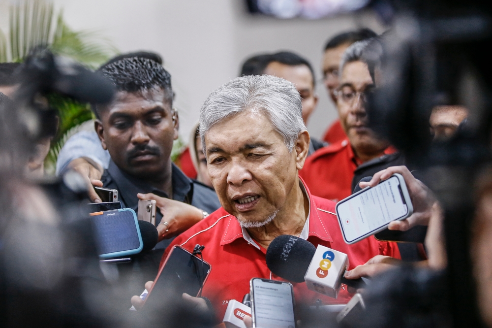 Umno president Datuk Seri Ahmad Zahid Hamidi speaks to reporters during the Umno general assembly at the World Trade Centre in Kuala Lumpur on June 7, 2023. — Photo by Hari Anggara
