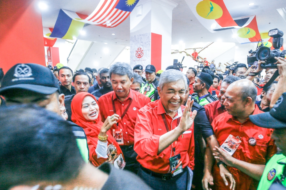 Umno president Datuk Seri Ahmad Zahid Hamidi with Umno deputy president Datuk Seri Muhamad Hasan arrive for the closed door briefing to Umno delegates before the Umno annual general meeting (PAU) at WTC Kuala Lumpur June 7, 2023. — Picture by Hari Anggara