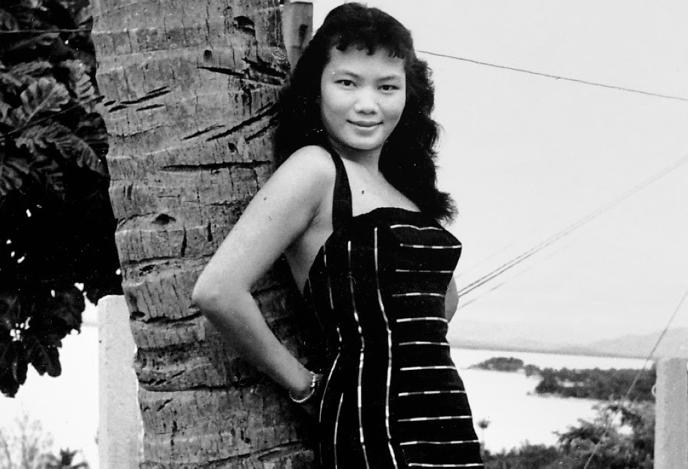 A lovely 20-something Chan posing underneath a coconut tree in Penang. — Picture courtesy of Clarity Publishing