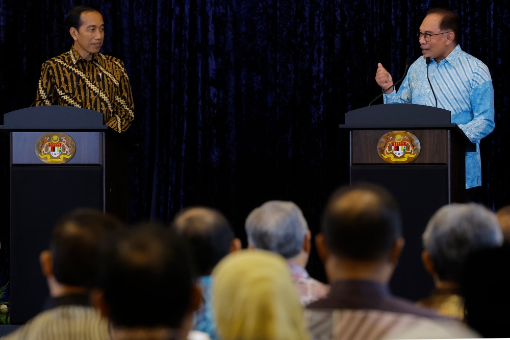 Prime Minister Datuk Seri Anwar Ibrahim with Indonesian President Joko Widodo during a press conference after holding a meeting at Seri Perdana June 8, 2023. — Bernama pic 