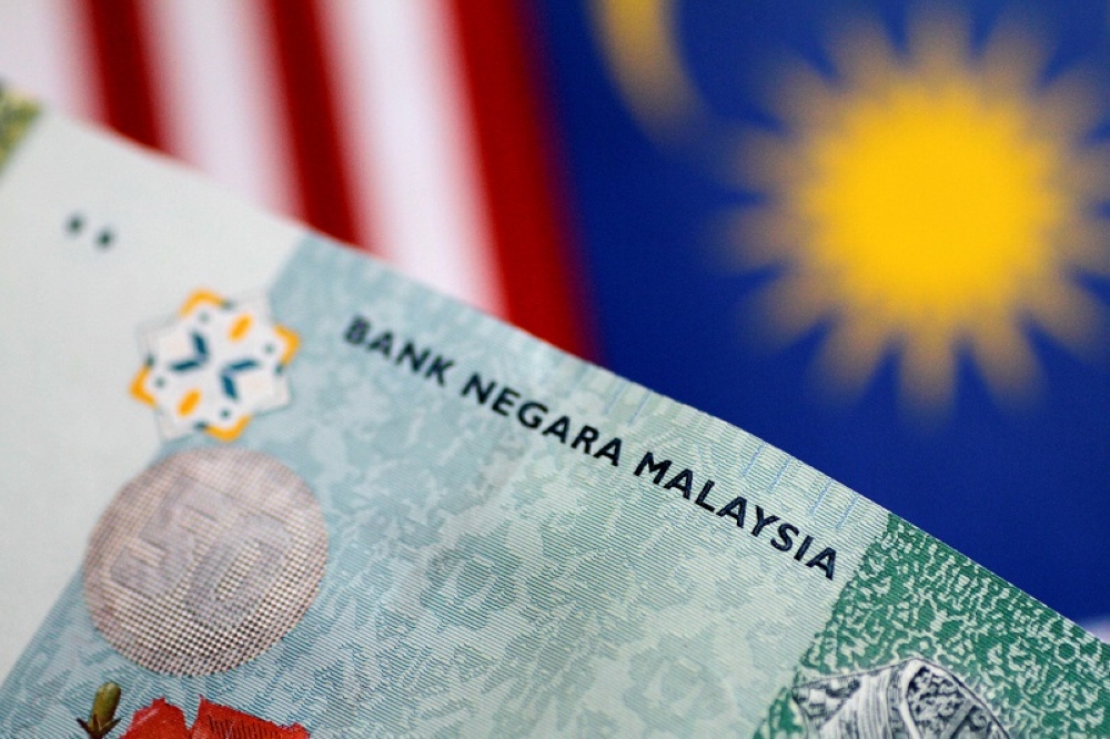 Ringgit ends lower against US dollar on weak demand | Malay Mail