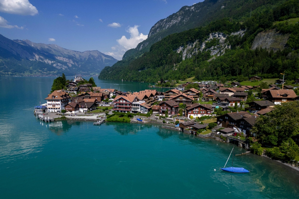 The village of Iseltwald at the shore of Lake Brienz, in the Swiss Alps. — AFP pic