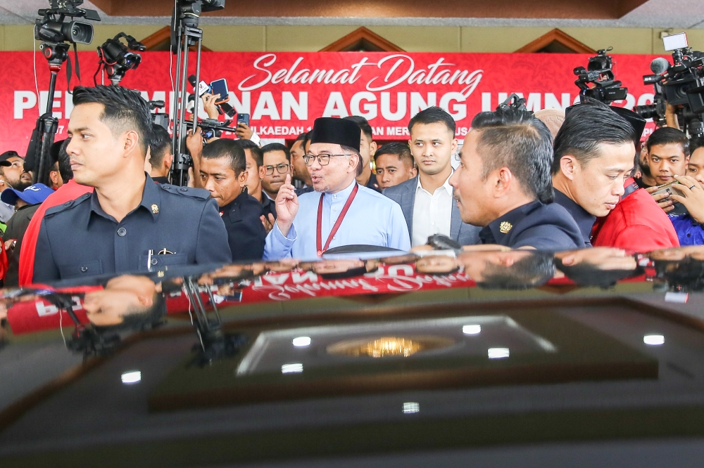 Prime Minister Datuk Seri Anwar Ibrahim (centre) attends the 2023 Umno general assembly at the World Trade Centre in Kuala Lumpur June 9, 2023. — Picture by Hari Anggara