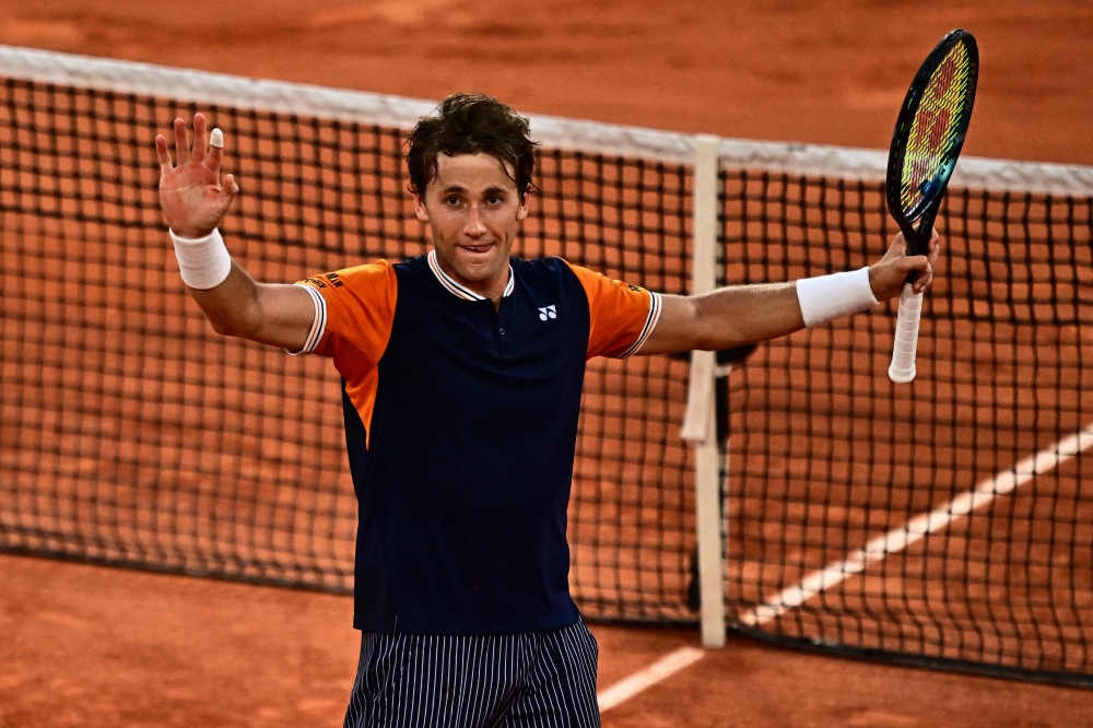 Norway’s Casper Ruud celebrates after winning against Germany’s Alexander Zverev at the end of their men’s singles semi-final match on day thirteen of the Roland-Garros Open tennis tournament at the Court Philippe-Chatrier in Paris on June 9, 2023. — AFP pic