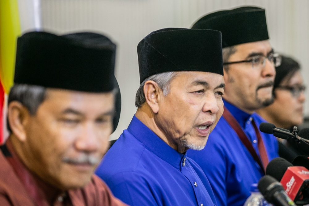 Umno president Datuk Seri Ahmad Zahid Hamidi (centre) speaks to the media during a press conference after the party’s 2023 general assembly at World Trade Centre in Kuala Lumpur June 10, 2023. — Picture by Hari Anggara 