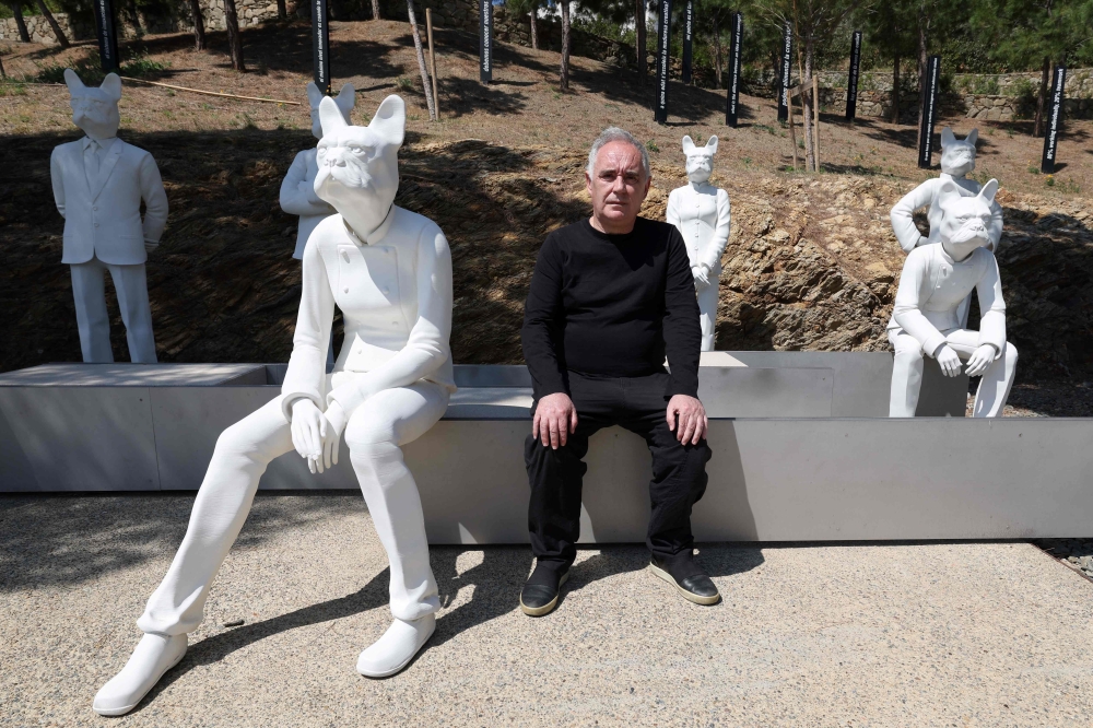 Spanish chef Ferran Adria poses next to sculptures he calls ‘Bullinanos’ outside of the El Bulli restaurant. — AFP pic 