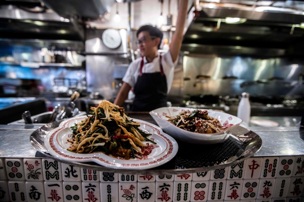 This photo taken on May 17, 2023 shows chef ArChan Chan speaking in the kitchen of the Ho Lee Fook restaurant in Hong Kong. The 37-year-old chef of Ho Lee Fook, located in the glitzy Central district, is one of the city’s most celebrated women chefs and among a handful of young innovators redefining Cantonese food. — AFP pic 