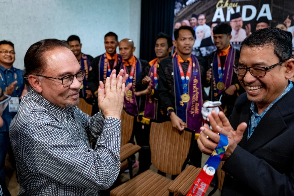 Prime Minister Datuk Seri Anwar Ibrahim with the national men’s cerebral palsy football squad, June 10, 2023. — Picture from Facebook/Anwar Ibrahim 