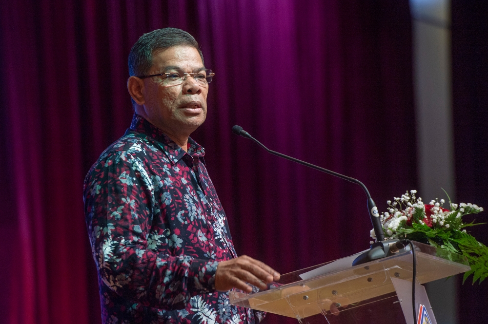 Home Minister Datuk Seri Saifuddin Nasution Ismail said Malaysians who are victims of job scams and find themselves stranded in foreign countries are those easily swayed by advertisements on social media offering job opportunities with attractive salaries and other benefits. — Picture by Shafwan Zaidon