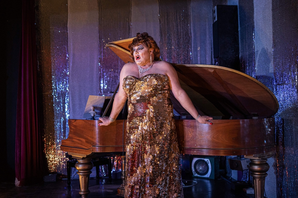 Dame Leyla Lamborghini, alter ego of hotel owner Jacques Rabie, performs on stage during the Saturday night show at the Karroo Theatrical Hotel. — AFP pic