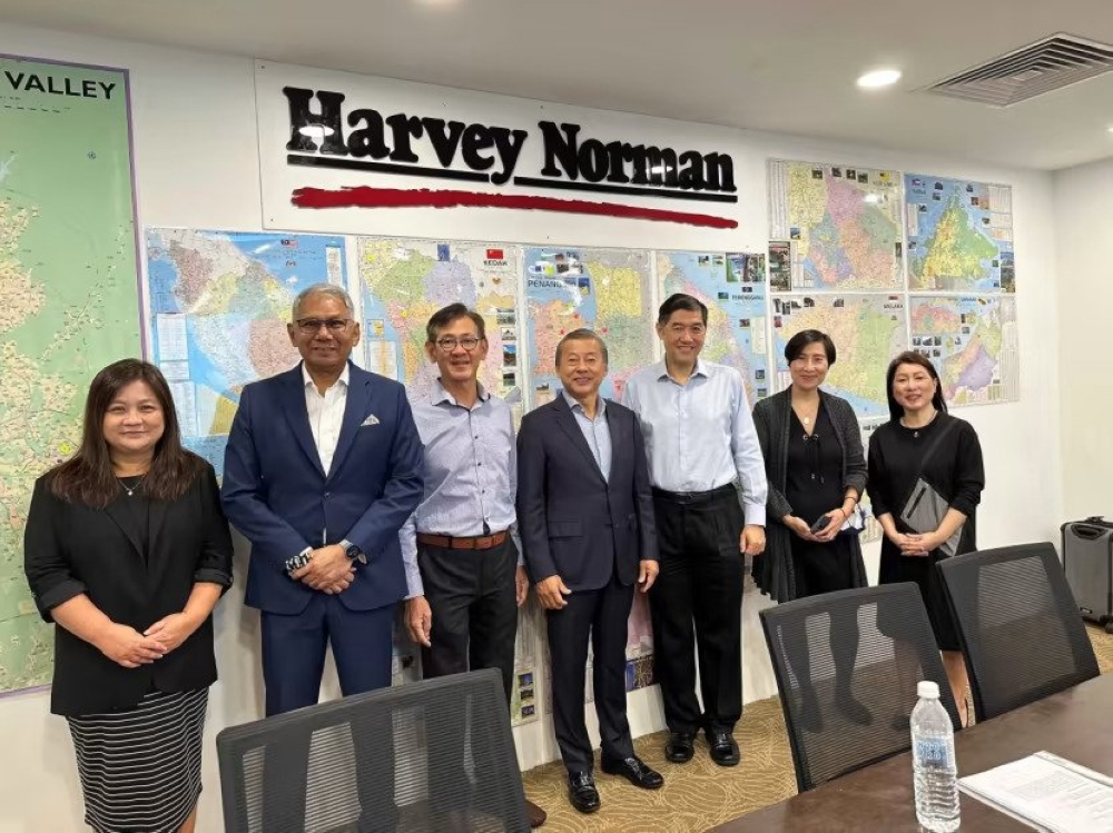 An undated photo of George Goh (centre) with the board and senior management staff members of Harvey Norman Asia from his website. — Picture by George Goh Ching Wah via TODAY