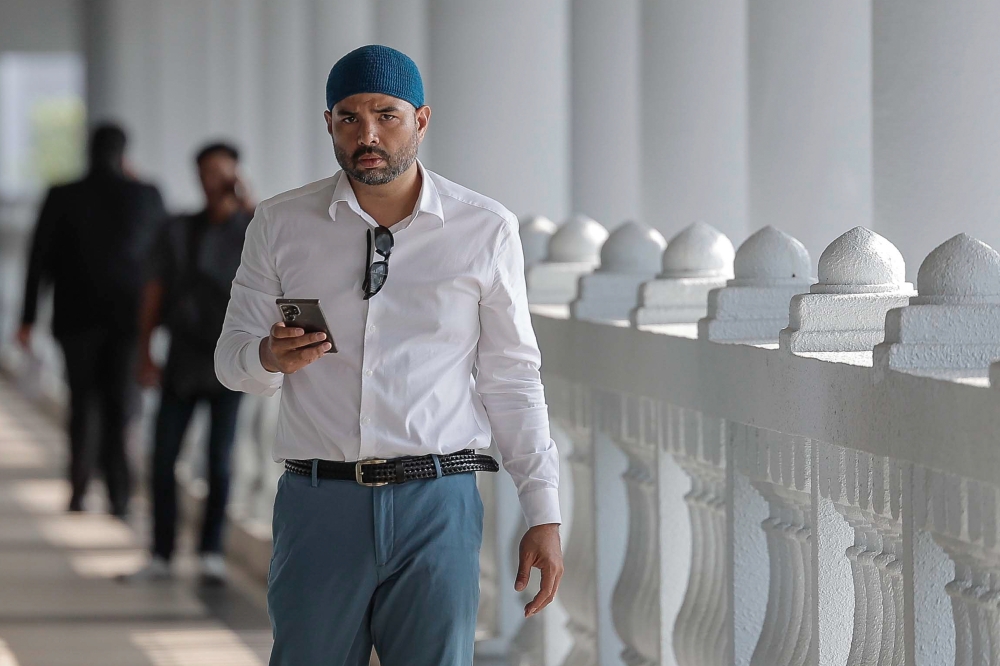 Mohamad Rizal, 40, was charged with making and initiating the transmission of offensive communications with intent to offend others via the Facebook application using the profile name ‘Rizal van Geyzel’, Instagram ‘rizalvangeyzel’ and TikTok ‘rizalvangeyzel’, between July 4 and 6, 2022. — Bernama pic