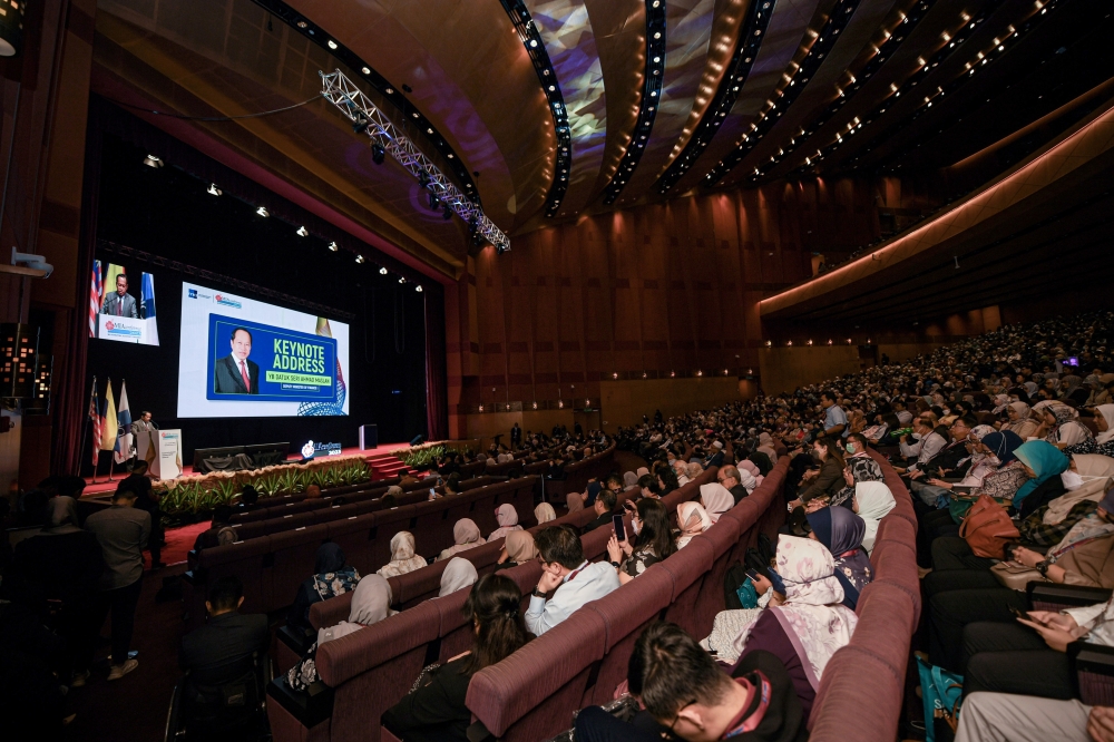 Deputy Finance Minister Datuk Seri Ahmad Maslan delivers a speech while officiating the meeting of the main committee of the Authorised Economic Operator compliance programme in Kuala Lumpur June 13, 2023. — Bernama pic 