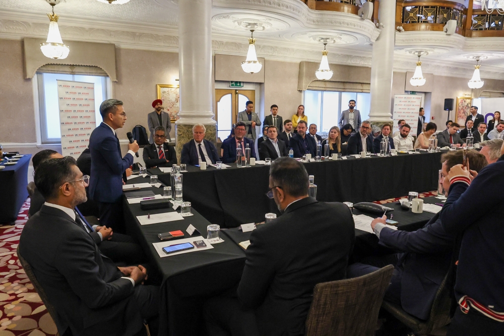 Communications and Digital Minister Fahmi Fadzil speaks at the Investor Dialogue Session in conjunction with London Technology Week in London, June 13, 2023. — Bernama pic 