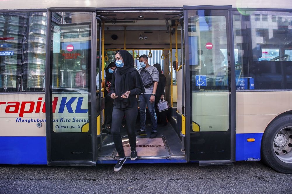 Passengers disembark from a RapidKL bus at KLCC May 4, 2020. — Picture by Hari Anggara