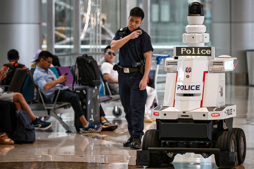 Singapore will progressively deploy more patrol robots across the city-state, police said yesterday. — AFP pic