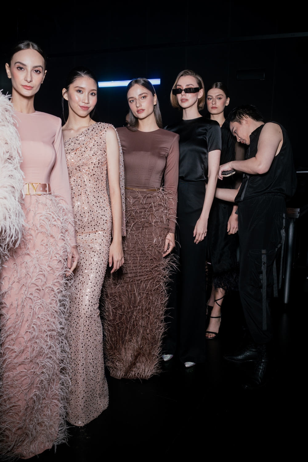 Designer Ivan Young backstage with the models before they hit the runway. — Picture courtesy of Ivan Young
