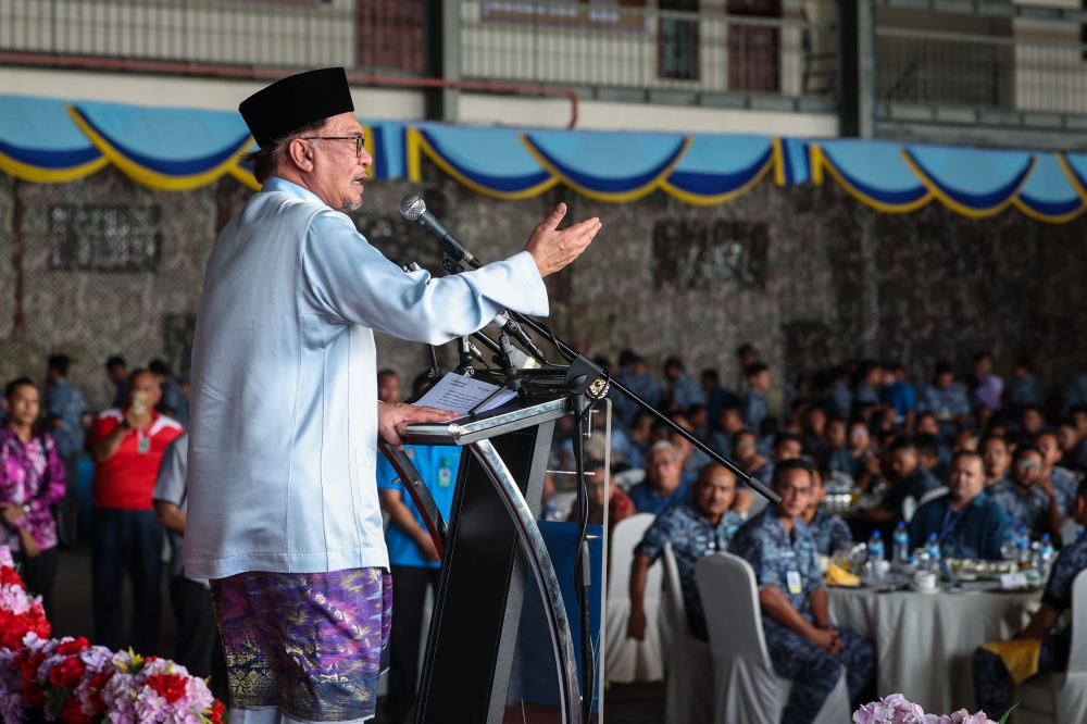 Prime Minister Datuk Seri Anwar Ibrahim gives his speech at a meet-and-greet session with the Royal Malaysian Airforce (RMAF) fraternity in Butterworth June 17, 2023. — Bernama pic