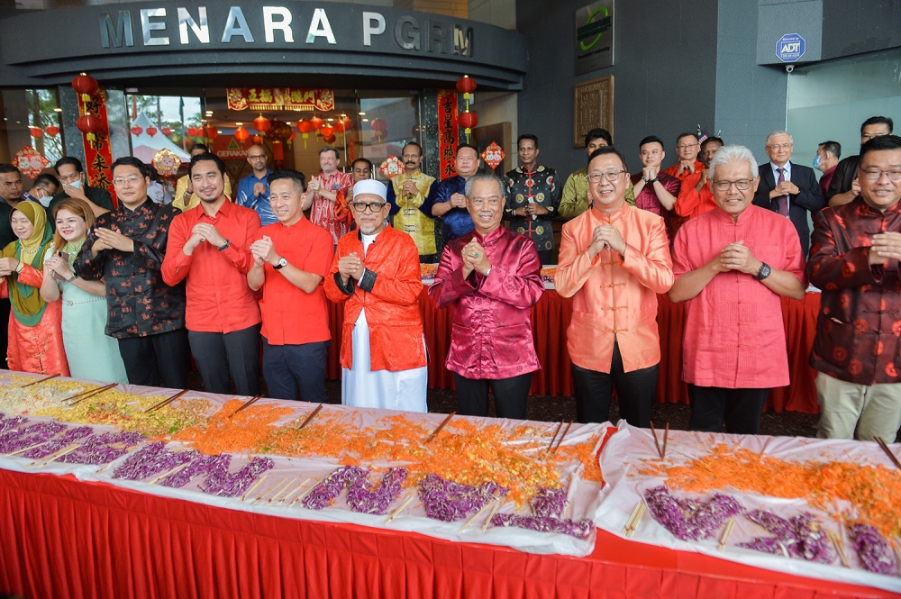 File photo of Tan Seri Muhyiddin Yasin, Haji Hadi and Dominic Lau at the Perikatan Chinese New Year open house celebration at Menara PGRM in Kuala Lumpur on January 22, 2023. — Picture by Miera Zulyana