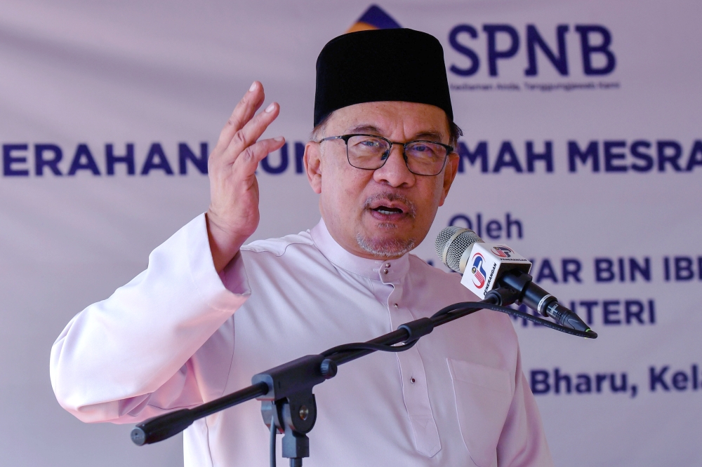Datuk Seri Anwar Ibrahim speaks at an event in Kampung Jaya in Kelantan, June 18, 2023. — Bernama pic