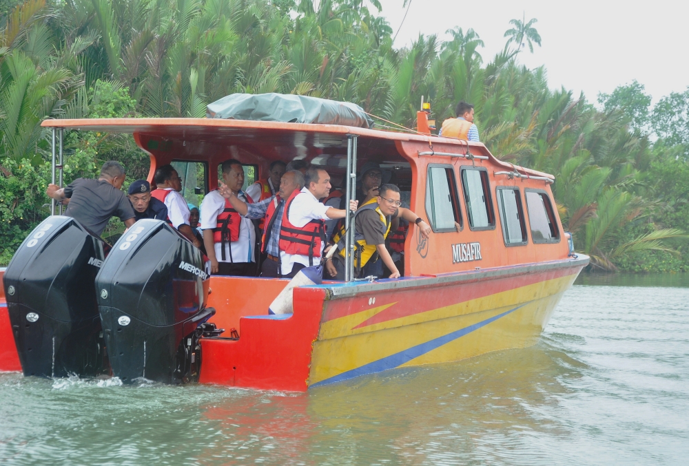 Minister of Natural Resources, Environment and Climate Change Nik Nazmi Nik Ahmad (right) is seen during a working visit to the site to complete the remaining work of the Sungai Besut Estuary Conservation Project in Jertih June 18, 2023. — Bernama pic