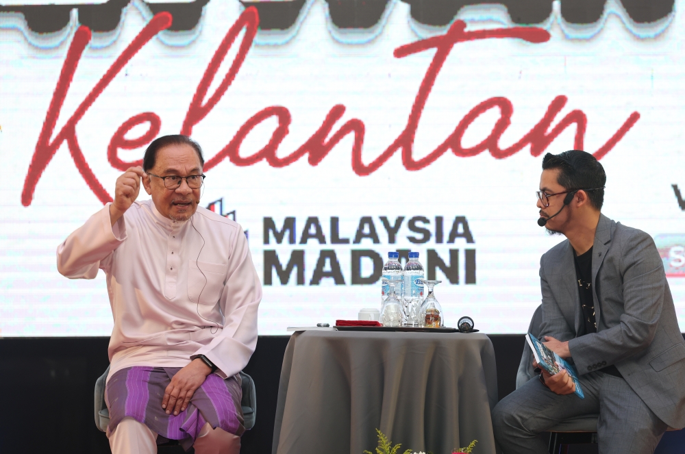 Prime Minister Datuk Seri Anwar Ibrahim speaks during a ‘Temu Anwar’ session at Universiti Malaysia Kelantan’s Bachok campus June 18, 2023. — Bernama pic