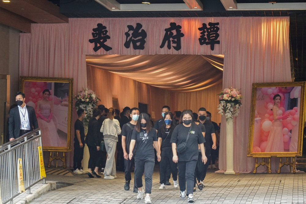 People leave the memorial hall that holds the religious vigil and funeral of model Abby Choi, who was murdered months ago, in Hong Kong, China, June 18, 2023. — Reuters pic