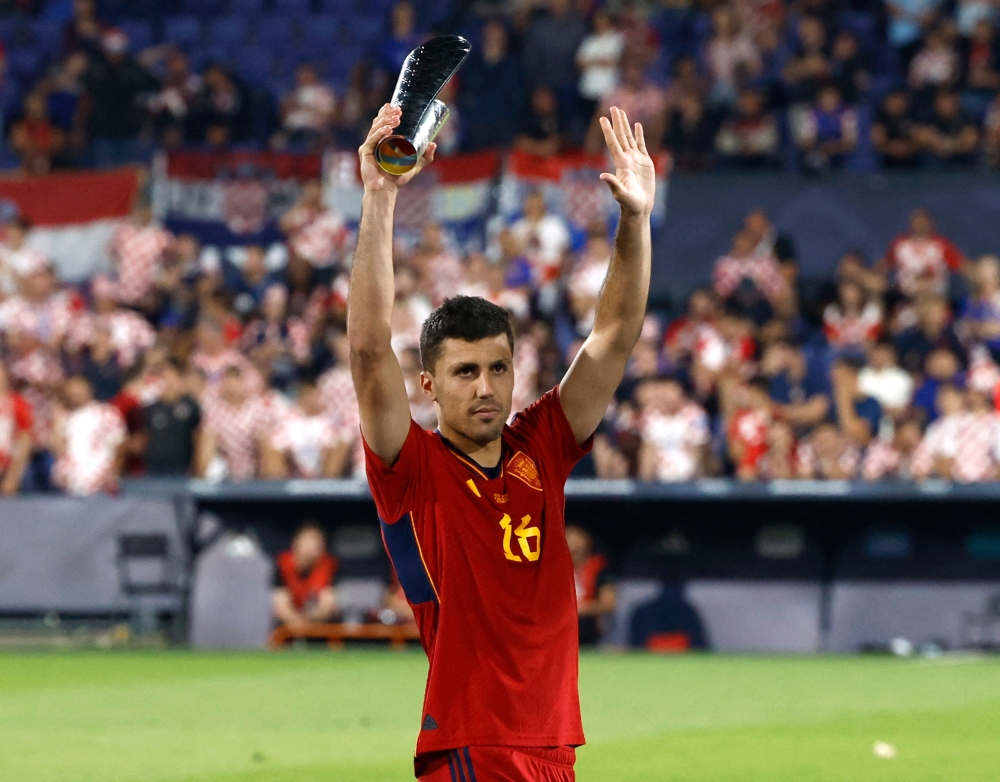 Spain’s Rodri celebrates with the player of the match award after winning the penalty shootout and the Uefa Nations League final in Rotterdam June 18, 2023. — Reuters pic