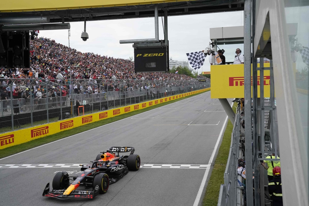 Red Bull Racing’s Dutch driver Max Verstappen  crosses the finish line to win the 2023 Canada Formula One Grand Prix at Circuit Gilles-Villeneuve in Montreal, Canada, on June 18, 2023. — AFP pic 